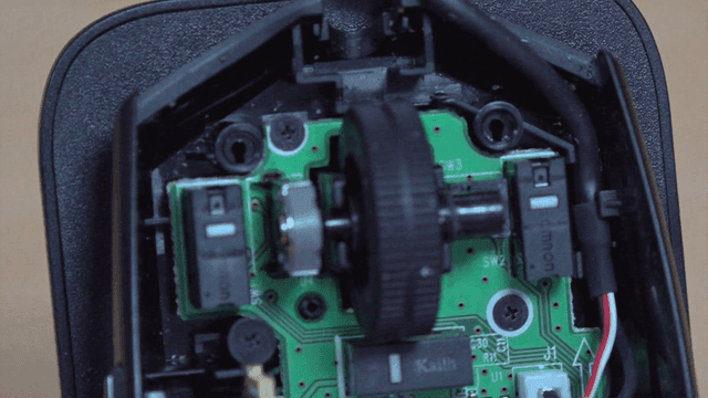 Cleaning dust from computer mouse circuit board