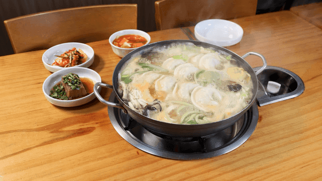 Dumpling hot pot simmering on dining table