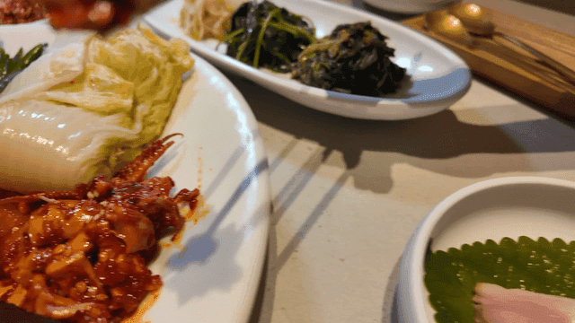Korean dishes with kimchi and boiled pork