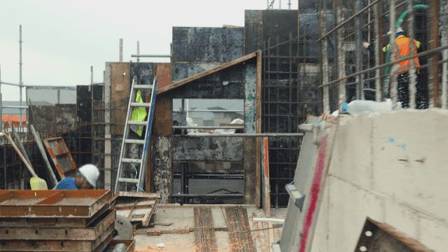 Construction site with workers and equipment