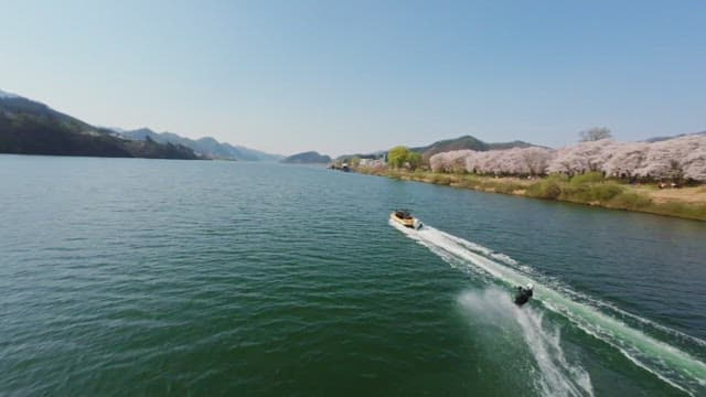 Person wakeboarding on a scenic river