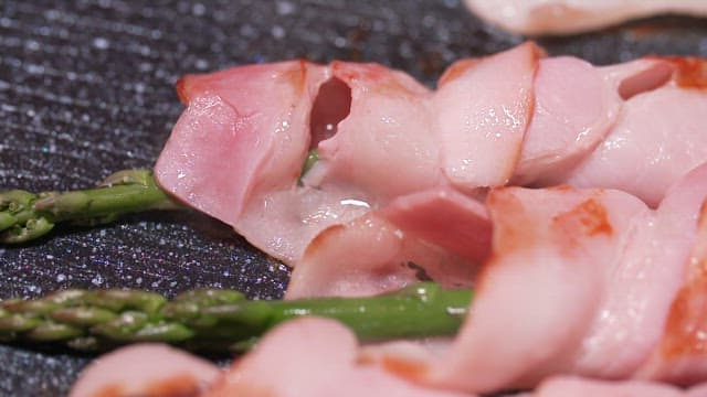 Thin-sliced Pork Belly and Asparagus Grilling on a Hot Pan