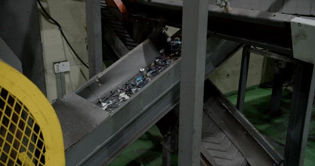 Conveyor belt sorting materials at a recycling plant