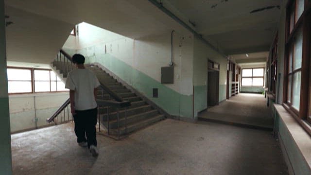 Students in an Abandoned School Hallway