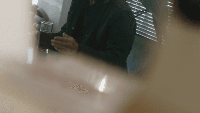 Cafe with man talking and iced Americano