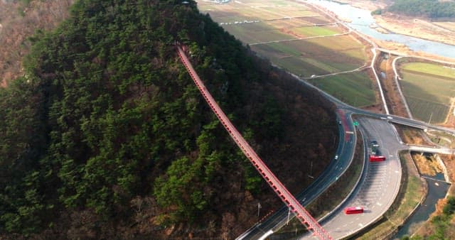 Aerial View of the Red Bridge Connecting Mountains