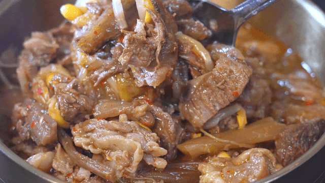 Korean beef soup filled with meat in bowl
