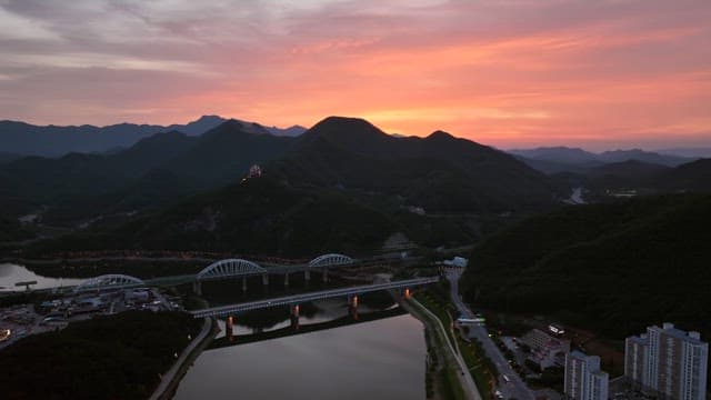 Sunset over mountains and bridges