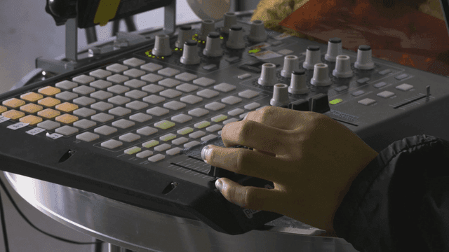 Hands controlling sound DJ console