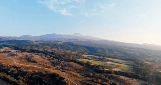 Expansive mountain landscape with forests