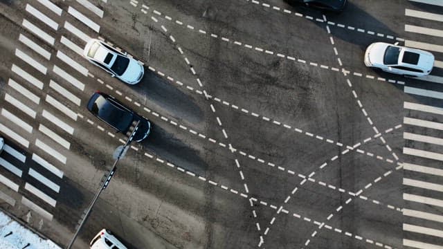 Busy Intersection with Many Cars Moving Around