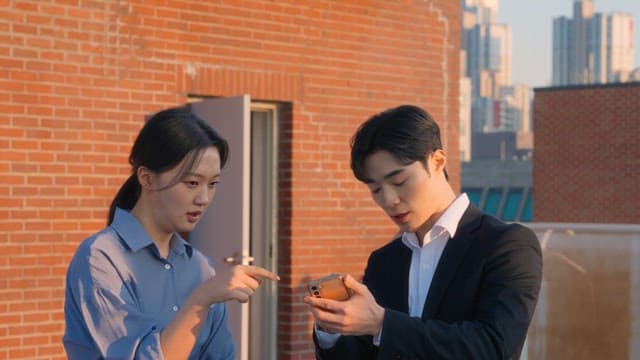 Two people discussing on a rooftop