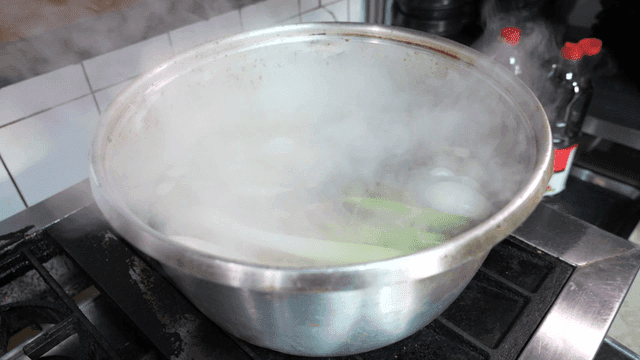 Broth boiling on stove.
