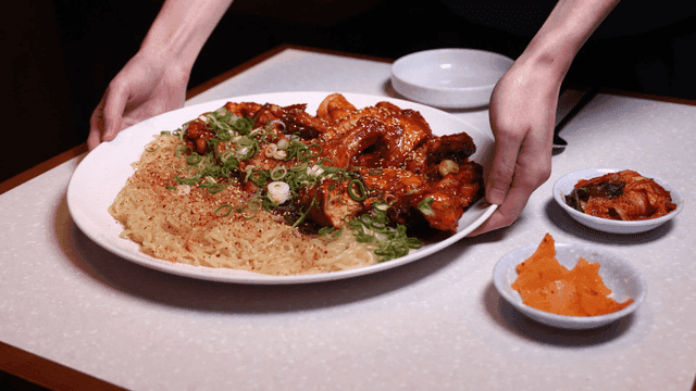 Table where spicy braised chicken is served