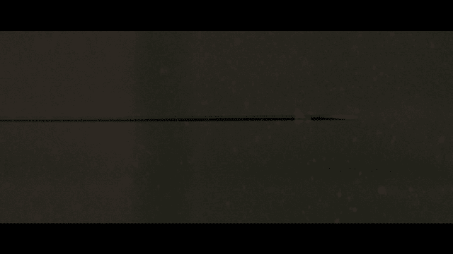 Arrow flying through air, piercing through raindrops