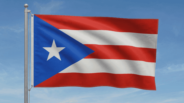 Puerto Rican flag fluttering under clear sky