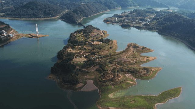 Scenic island surrounded by lake