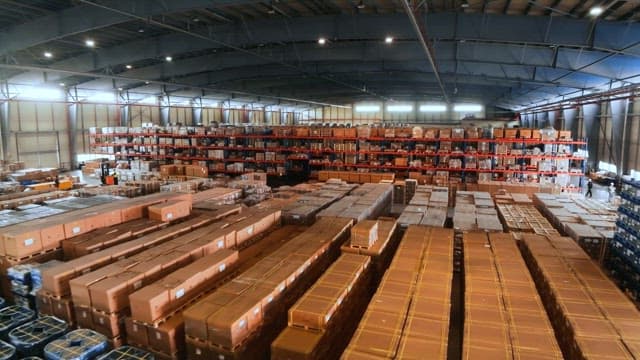 Large warehouse with numerous boxes neatly stacked