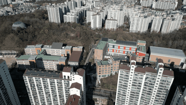 Aerial view of city with high-rise apartments