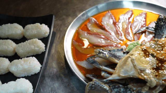 Soy sauce marinated crab, shari, and sashimi