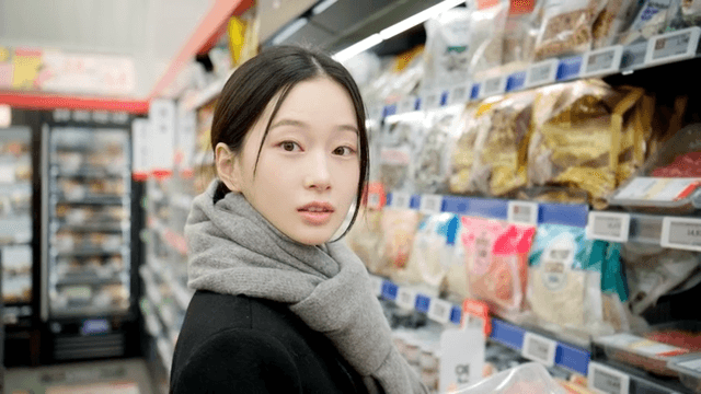 Woman looking at meat at supermarket