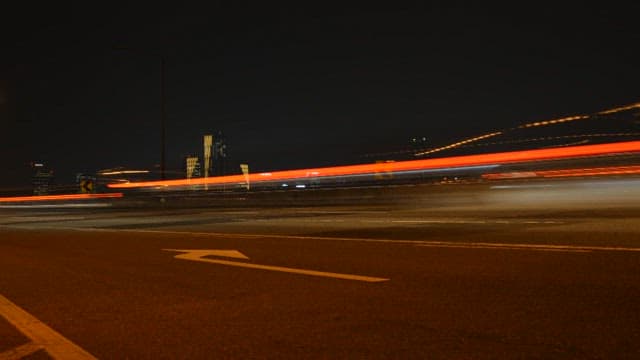 Road Illuminated by the Lights of Running Vehicles