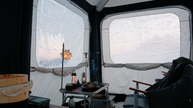 Cozy Interior of a Tent in Snowy Winter Campsite