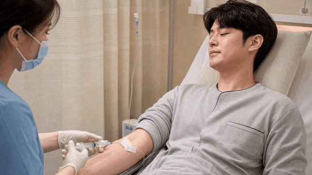 Male patient receiving injection at hospital