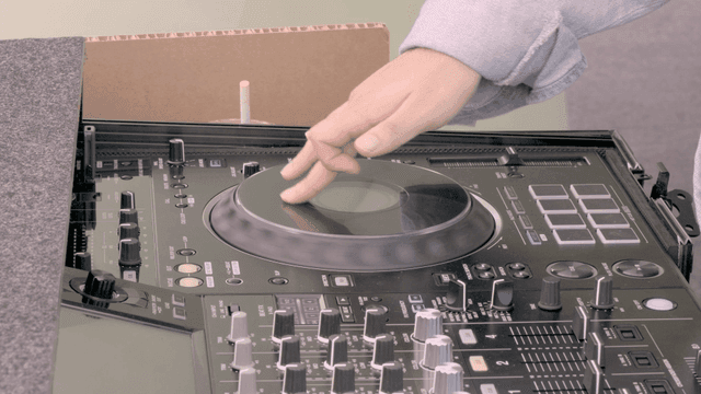 DJ mixing music on a turntable