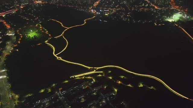 Illuminated paths in a city park at night