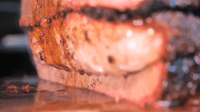 Juicy grilled meat with dripping sauce