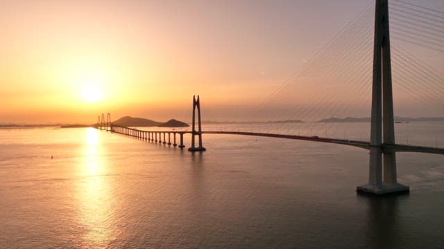 Bridge over the sea at sunset