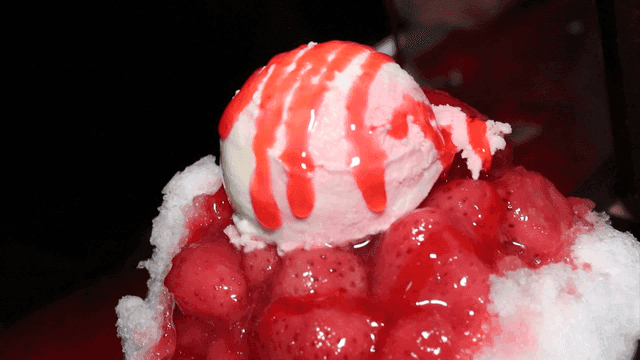 Ice cream with strawberry syrup on shaved ice