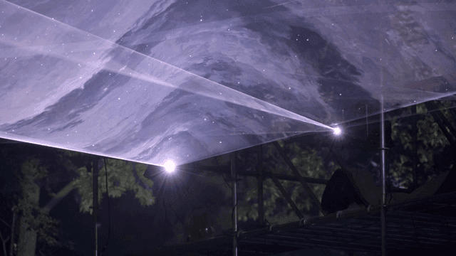 Projection of abstract visuals in a dark setting