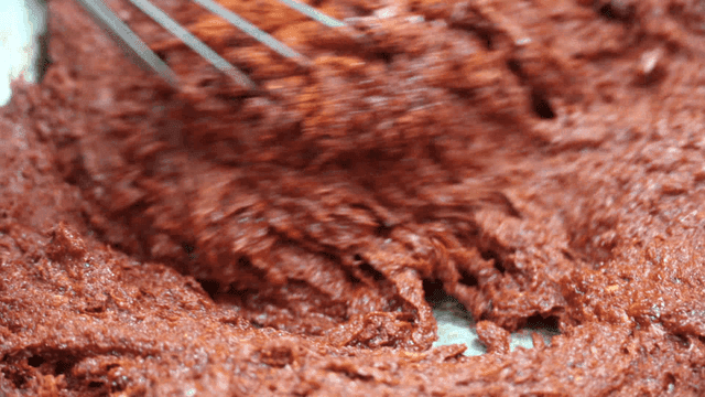 Spicy pepper seasoning mixed with whisk in bowl