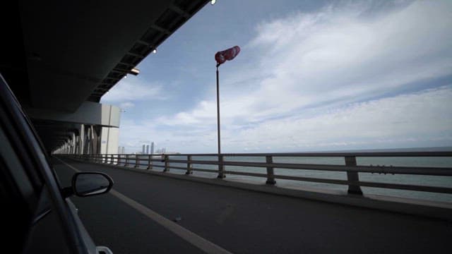 Driving through an expansive bridge over sea