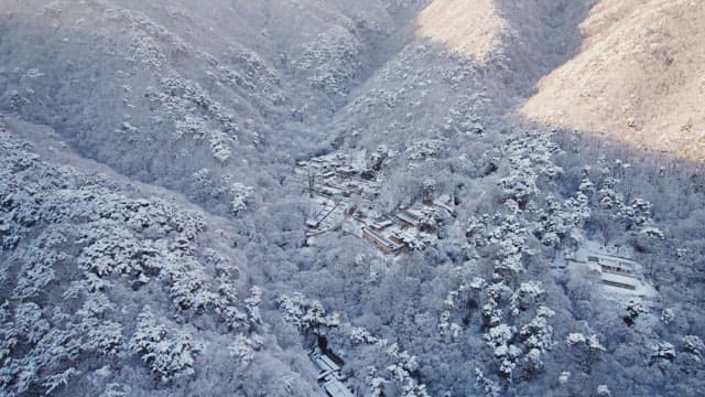 Snow-covered traditional Korean temple