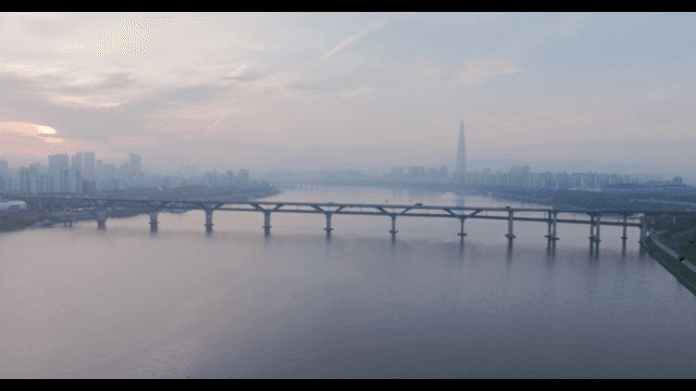 City skyline with a river and bridge