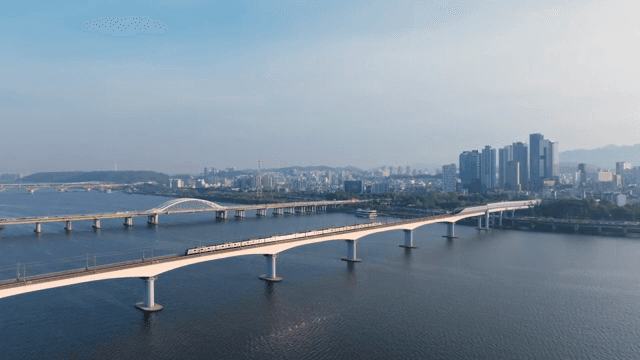 A city skyline with bridges over a river