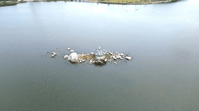 Small island with a pavilion on a lake
