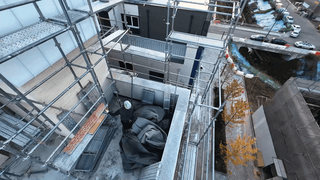 Construction workers working on roof