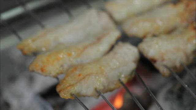 Grilling fish skewers on a barbecue