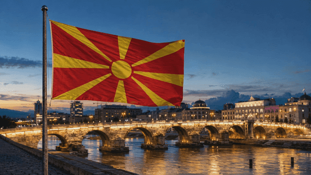 Night view of city bridge and North Macedonian flag