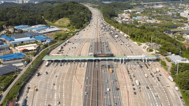 Busy highway with toll booths and traffic