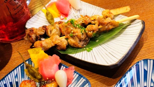 Table generously laid out with a variety of Japanese cuisine