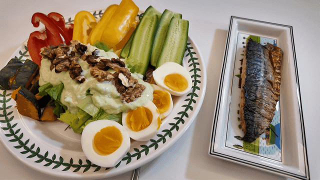 A healthy meal with salad and grilled fish
