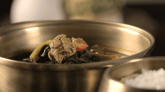Korean beef soup and rice in brass bowls