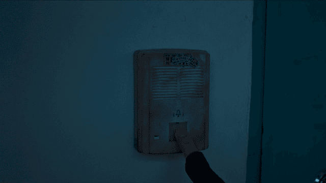 Finger pressing doorbell button