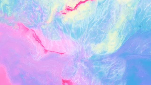 Abstract pattern with mixing pink, blue and purple liquids