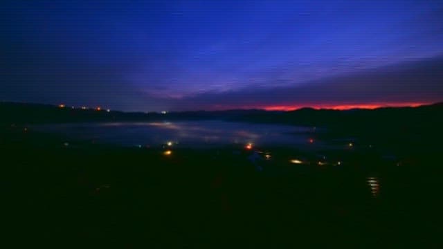 Sunrise in a foggy mountain valley